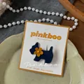 Detailed close-up of a blue flocked dog hair clip with a yellow flower on a white card - Yellow Flower Dog (NK2411)