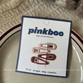 Detailed view of four teardrop-shaped pink and red hair clips on a gift card display - Pink Water Drop Hair Clips