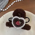 Detailed macro view of brown plush hair claw clip with heart strawberry embroidery - Dark Coffee Strawberry Bow Claw Clip