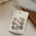 Simpatiche mollette per capelli a stella per bambine con pois bianchi in toni terra - Stile Stella Cadente