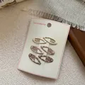Set of six cute polka dot BB hair clips in beige and brown tones for girls - Mini Oval Style