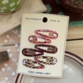 Detail view of 6-piece cute cartoon bear and leopard print BB hair clips on display card - Cat Cloud Style (NK2788-1)