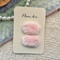 Set of two soft pink plush hair clips for girls displayed on a premium card holder - Pink