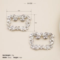 Detail view of silver rhinestone shoe clips measuring six centimeters by four centimeters - Square Buckle Style (SC-J045)