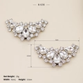 Detail view of 6x3.5cm rhinestone shoe clips with sparkling pear-cut silver buckles - Crescent Style (SC-J048)