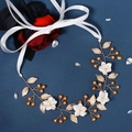 Detailed view of handmade golden bridal headband with metal leaves and white floral accents - Hs-j6564g