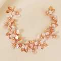 Dettaglio della fascia vintage dorata con petali rosa, perline e foglie di metallo - Stile Petalo Rosa Foglia d'Oro (HS-J7346G)