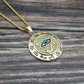 Ägyptische Horusauge-Halskette aus Edelstahl mit goldenem runden Anhänger auf Holz - Gold Schwarz Gerieben Einzelanhänger