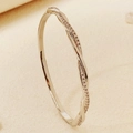 Elegant gold-tone crossed bangle with sparkling zirconia pavé and shell starfish detail - Silver Mobius Ring Style (BS-J5655S)
