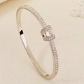 Silver-tone ocean bangle with shell design and shimmering cubic zirconia stones - Silver Treasure Box Style (BS-J5656S)