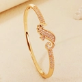 Elegant gold-plated seahorse bangle with pave-set cubic zirconia and hidden clasp - Gold Seahorse Style (BS-J5657G)