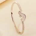 Elegant gold seahorse bangle featuring pave-set cubic zirconia and a secure metal clasp - Silver Seahorse Style (BS-J5657S)