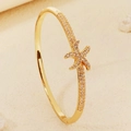 Golden starfish open bangle featuring pavé-set sparkling crystals for women - Gold Starfish Style (BS-J5658G)