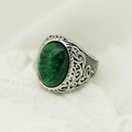 Vintage viking style men's silver ring featuring a large oval green gemstone centerpiece - Steel Band + Green Stone