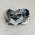 Detailed macro view of heart-shaped hair claw with black and white ink marble texture - Grey Ink Pattern