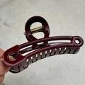 Detail of burgundy safety pin hair claw clip with gold spring and glossy finish - 11.5cm Door Lock Safety Pin Style