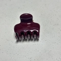 Detail view of large burgundy hair claw clip with glossy finish and spring mechanism - 4.5cm Square Spine Style