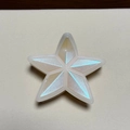 Macro shot of colorful pearlescent star hair claw with laser rainbow gradient finish - Beige Glitter Star Patch Claw Clip