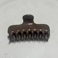 Detailed top view of a glossy dark brown hair claw clip with a strong spring and curved teeth - Square Bone Style / 9.5CM / Dark Coffee