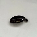 Close-up of a glossy dark brown banana hair clip with golden Barrette La France text - Small / Red Brown