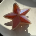 Détail d'une pince à cheveux en forme d'étoile avec fini pailleté orange et rose - Étoile Rose Pourpre avec Paillettes Argentées