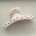 Close-up of a large cream-colored hair claw clip with black polka dots on grey fabric - Arc Hair Claw / Extra Large (Approx 12cm) / White