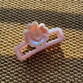 Detail of pink rectangular hair claw clip with 3D pearlescent floral ornament - Rectangular Claw Clip / Purple Pink