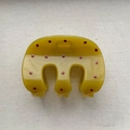 Detailed view of an olive green hair claw clip with red polka dots and metal spring - Three-Claw Clip / Medium (Approx. 8cm) / Yellow