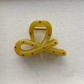 Detail of yellow polka dot hair claw clip with golden spring on beige fabric - Small Bow Claw Clip / Medium (Approx. 8cm) / Yellow