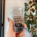 Set de 9 gomas de pelo en espiral de color marrón y negro en caja de plástico - Negro Gris Transparente