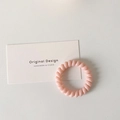 Elastic spiral hair tie in light pink color for women, minimalist telephone wire style - Light Pink