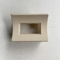 Top view of a large matte beige rectangular hair claw clip on a terrazzo surface - Square Style / Off White