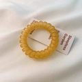 Frosted yellow spiral hair tie with a matte finish for a non-marking seamless hold - Yellow