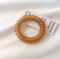 Frosted matte spiral hair tie in translucent orange resin with a traceless design - Orange