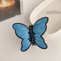Elegant butterfly hair claw clip in sky blue and black finish for chic ponytails - Light Blue