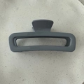 Close-up of minimalist grey rectangular hair claw clip with glossy finish and metal spring - Glossy Grey Blue