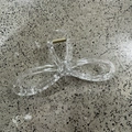 Detail of transparent hollow bow hair claw with gold spring and anti-slip teeth - Clear