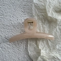 Detail of jelly colored hair claw clip with golden metal spring on aesthetic background - Snow Bud Pink