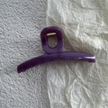 Detail view of large purple jelly hair claw clip with golden metal spring for women - Fruit Purple