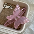 Close-up of pink marble acetate butterfly hair claw clip with woven ribbon detail - Rose Red