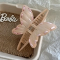 Detail of pink resin butterfly hair claw clip with ribbon edges and metal spring - Flesh Pink