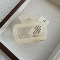 Detail showing cream square hair claw clip with golden Barrette La France text engraving - Jelly White Large Arch Claw (Style B)