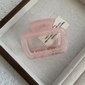 Detail of pink translucent rectangular hair claw clip with golden Barrette France text - Transparent Pink Large Arch Claw (Style B)