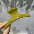Macro detail of glossy olive green M-shaped hair claw clip made of durable PC material - 11cm Arch Shape / Yellow-Green