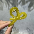 Detail view of large bright yellow translucent M-shaped hair claw clip with strong spring - 8cm Small Bowknot / Yellow-Green