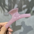 Detail of pink semi-transparent M-shaped hair claw clip with strong spring mechanism - 11cm Arch Shape / Pink