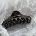 Detailed view of glossy 14cm large hair claw clip on elegant white paper - Dark Coffee