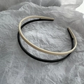 Detailed view of matte black and cream non-slip headbands with inner grip teeth texture - Black and White