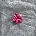 Detailed macro view of the marble pink floral cellulose acetate hair claw clip - Gradient Rose Red