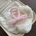 Detailed close-up of a pink marble pattern ribbon hair claw clip with golden spring - Pink